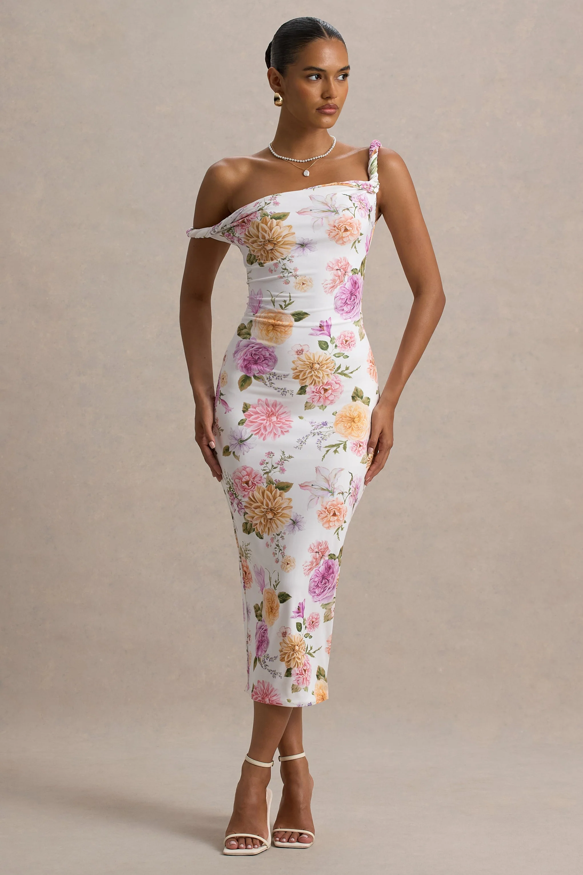 Nora | Pfirsich- und fliederfarbenes Midikleid mit Blumenprint und asymmetrischem Ausschnitt